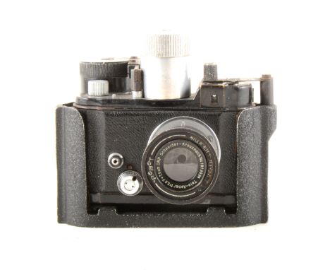 A WW2 Robot Luftwaffe Eigentum camera, with a 75mm f=3.8 Tele-Xenar lens serial no.1819694, with Robot housing.