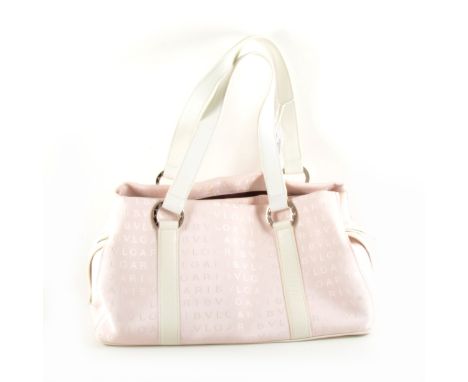 A Bulgari pink fabric handbag, white leather straps and Bulgari emblem to the fabric and ring retainers, open pockets to side