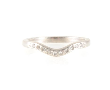 A diamond eternity/wedding ring, ten 8 cut diamonds set in an all white 2.2mm wide metal curved band, approximate weight 3.9g