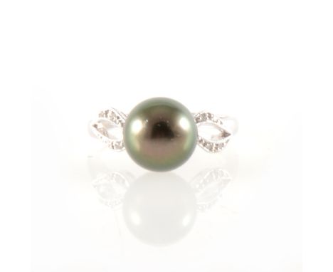 A Tahitian pearl and diamond ring, the 10mm pearl peg set between two shoulders, each shoulder parting at the front with four