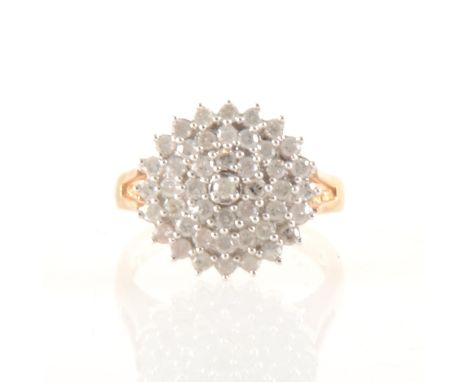 A diamond circular cluster ring, the forty-five small round diamonds claw set in a 9 carat yellow and white gold mount, diame