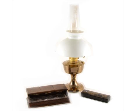A brass oil lamp, complete opaque shade and chimney, 61cm; an oak desk stand; black lacquered pen box; and an aneroid wall ba