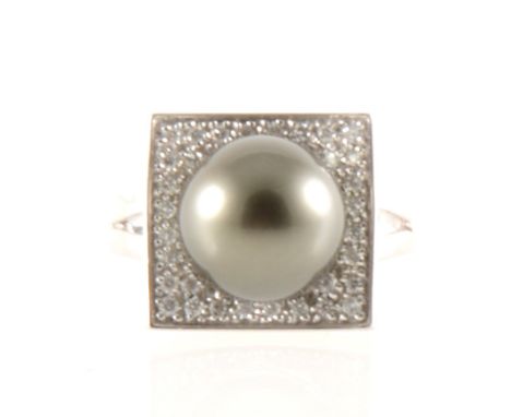 A Tahitian pearl and diamond ring, the 11mm pearl peg set to the centre of a white metal square pavé set with thirty-two diam