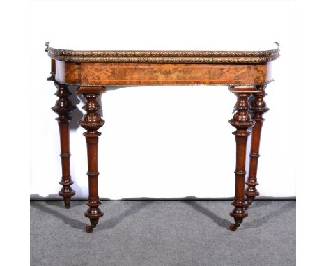 A Victorian figured walnut and gilt metal mounted card table, with narrow banding and stringing, foldover top, enclosing a ba