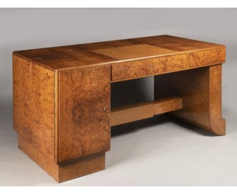 AN ART DECO DESK Cca 1930 Bird's-eye elm, brass and leather 80 x 80 x 166 cm This bird’s eye veneered desk presents the synth