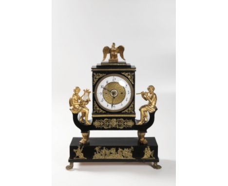 AN EMPIRE CLOCK WITH MUSIC BOX 1830s Wood, brass, glass, blackened and gilded 60 x 47 x 17,5 cm Marked on clockwork on back: 