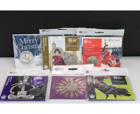 A collection of Royal Mint £5 / Crown coin sets to include The Tower of London, Nutcracker and England World Cup together wit