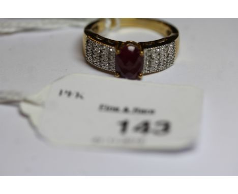9ct gold mounted ruby and diamond set ring, the oval ruby approx 0.6ct, ring size P/Q