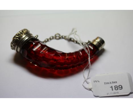 Victorian white metal (thought silver) mounted ruby glass scent bottle of Cornucopia shape, the body with concave cutting, sl