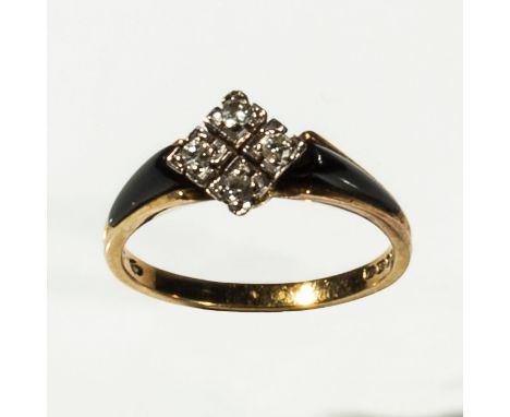 An 18ct gold four diamond and black enamel ring, size M