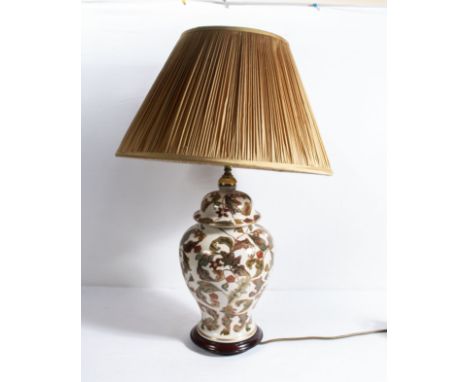 A Chinese style porcelain table lamp with shade decorated with a leaf design, base 40cm tall