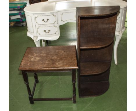 A corner open book shelf and a side table