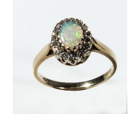 A 9ct gold opal and diamond cluster ring, size N