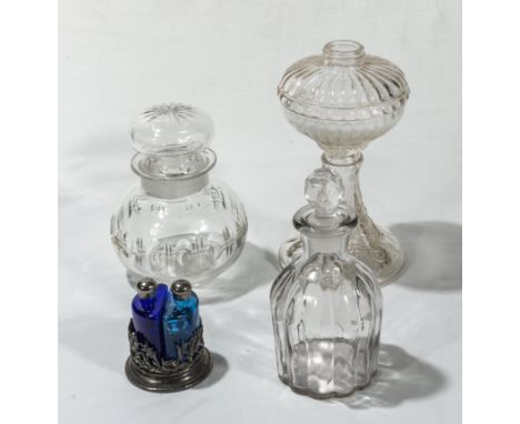 A decanter, lamp base, perfume bottles and a lidded jar