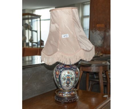A Chinese style pottery table lamp and shade