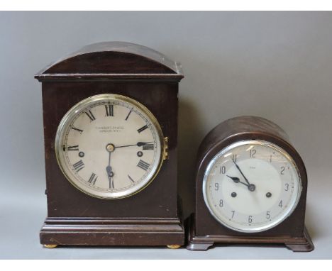 A Camerer Cuss & Co table clock, the silvered dial with Roman numerals, the repeating movement striking on gongs, and an Enfi