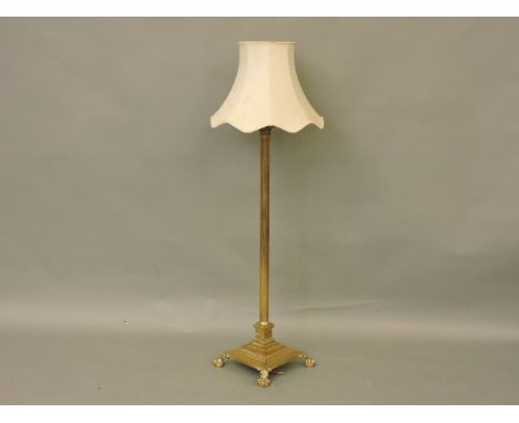 A brass Corinthian column lamp, on square base with claw feet
