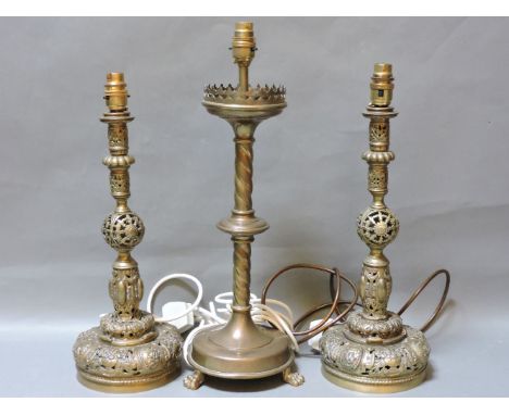 A pair of French brass table lamps, with cast and pierced decoration, 44cm high, another, and a Victorian Gothic oil lamp wit