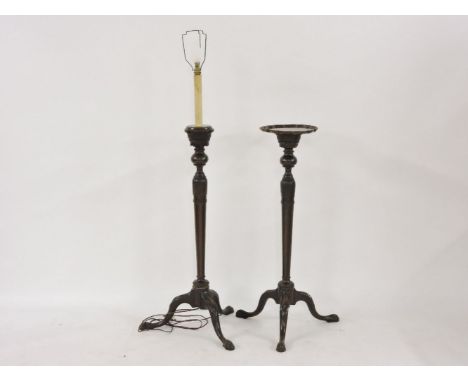 Two mahogany torchères, one converted to a standard lamp, 107cm high