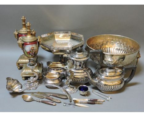 A pair of metal mounted urns, a four piece plated teaset, a punch bowl and ladle, a tazza, a silver mustard, two candlesticks