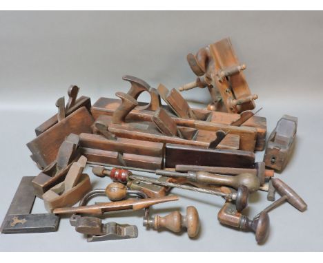 Woodworking tools, including a smoothing plane, 55cm long, moulding planes, and two braces