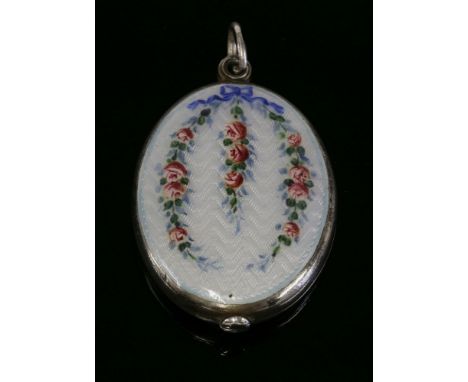 A Continental silver slide action enamel oval locket mirror, circa 1910, guilloché enamel decoration to the front cover with 