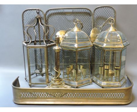 A pair of hexagonal glazed hall lanterns, another similar, a grass table lamp, fender, and fire screen