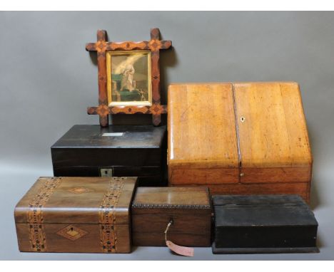 An oak stationery cabinet, rosewood tea caddy, coromandel dressing case with two drawers, marquetry frame, etc