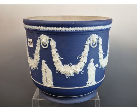 A WEDGWOOD BLUE DIP JASPER PLANTER WITH CLASSICAL FIGURES STANDING BELOW SWAGS OF GRAPES.   Dia. 26cms.