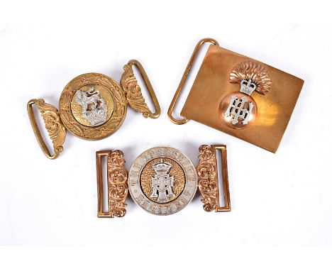 Three Regimental brass and white metal belt buckles, comprising Highland Light Infantry, The Yorkshire Regiment and another (