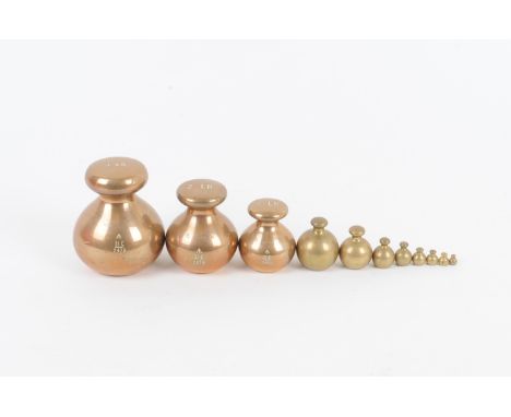 Brass weights,  dumpy spherical 1, 2 and 4lb weights, proof marks, broad arrow, 1955, smaller spherical weights (8), nest of 