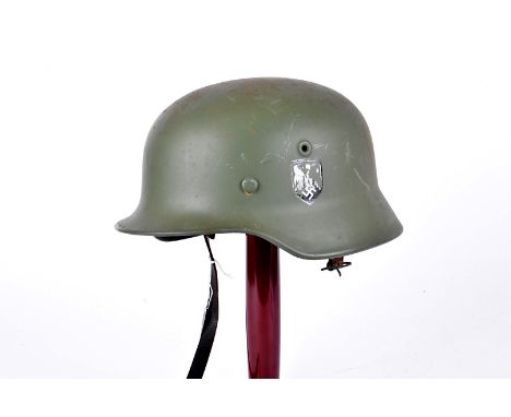 A Reproduction German Army Double Decal helmet, in green, with army decals to either side, complete with liner and chin strap
