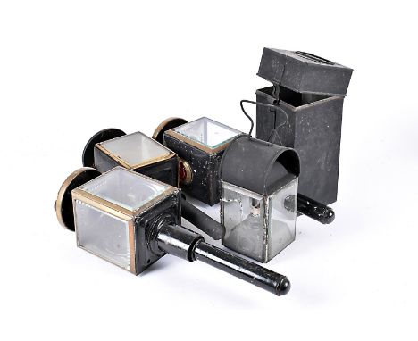 A pair of black painted coach lamps, together with another similar, plus a cased railway lamp, all AF (4) 