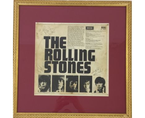 ROLLING STONES FRAMED SIGNED ALBUM - A mounted and framed copy of the reverse of the Rolling Stones' debut album sleeve, sign