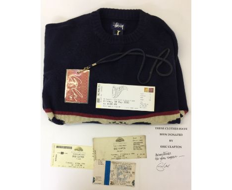 CLAPTON OWNED AND WORN JUMPER - Lot to include 1x size L 'Stussy' jumper donated to a charity shop by Eric Clapton. Sold with