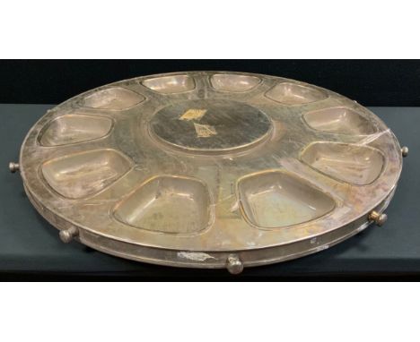An enormous E.P.N.S. lazy Susan, with ten bowl apertures, button handles, 93cm diam 