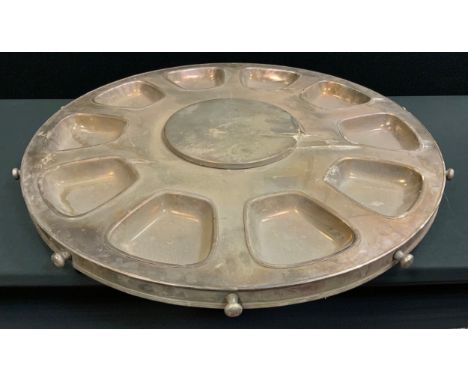 An enormous E.P.N.S. lazy Susan, wiith ten bowl apertures, button handles, 93cm diam 
