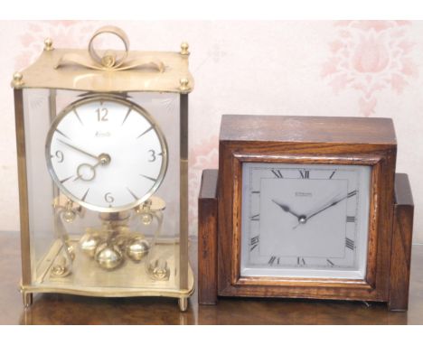 A 1930 oak mantel clock, Sterling Electric;  a Kundo brass perpetual clock (2) 