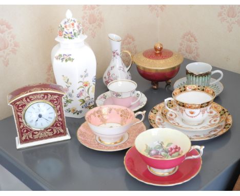 A Paragon cabinet cup and saucer, printed with colourful flowers, on a pink ground;  another, with ripe fruit;  other cabinet