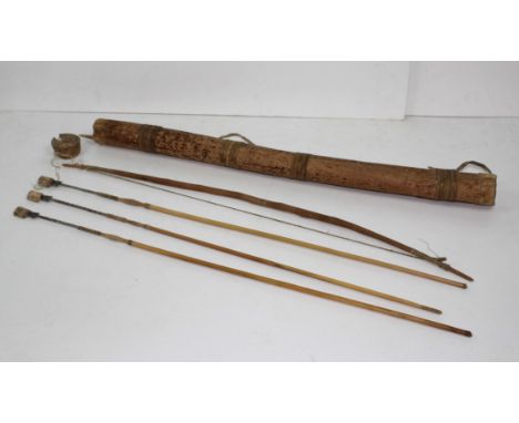 Traditional South American hunting bow and three arrows, in hollowed wooden strung carrying case (4)