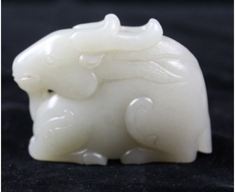 A Chinese greenish white jade carved as a ram, 7cm max