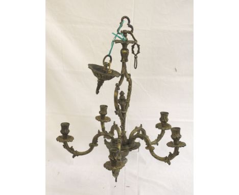 A five light ormolu chandelier, foliate 'S' scroll arms about an openwork central stem with flower finial, fitted for electri