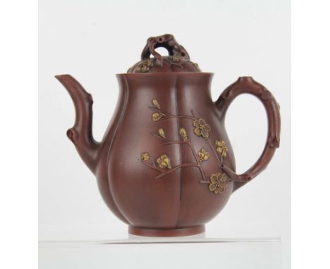 A Chinese YiXing red ware tea pot and cover, melon form with crabstock handle and spout, moulded in high relief with flowerin