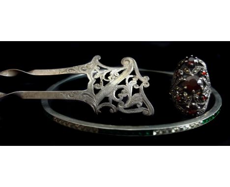 A vintage green and white paste bangle c1920; a garnet and marcasite dress ring; and an antique silver Art Nouveau style hair