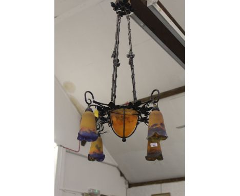 A wrought iron and Muller Freres glass Chandelier, the iron support decorated with vine leaves, the glass of moulded orange/p
