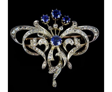 A French belle époque sapphire and diamond pendant brooch, c1905, of stylised scroll design set to the centre with four circu