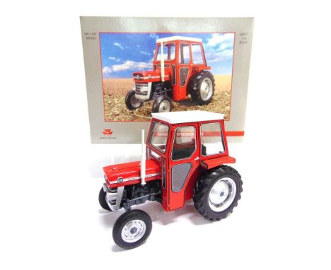 A 1/16 SCALE UNIVERSAL HOBBIES MASSEY FERGUSON 135   red and grey, mint or near mint, boxed.