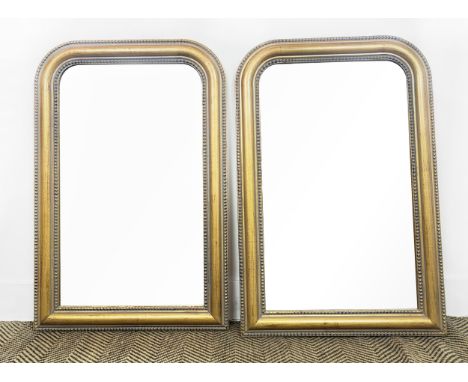 OVERMANTEL WALL MIRRORS, a pair, of compact proportions, Victorian style, with gilt frames, each 57cm W x 87cm H. (2)