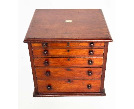 CLOCKMAKERS CABINET, 19th century mahogany with six graduated drawers, (retaining a selection of clockmakers tools), 39cm W x