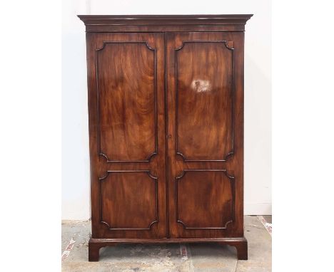WARDROBE, late 19th century George III style mahogany with two doors enclosing a shelf, hanging rail and hooks, 187cm H x 119